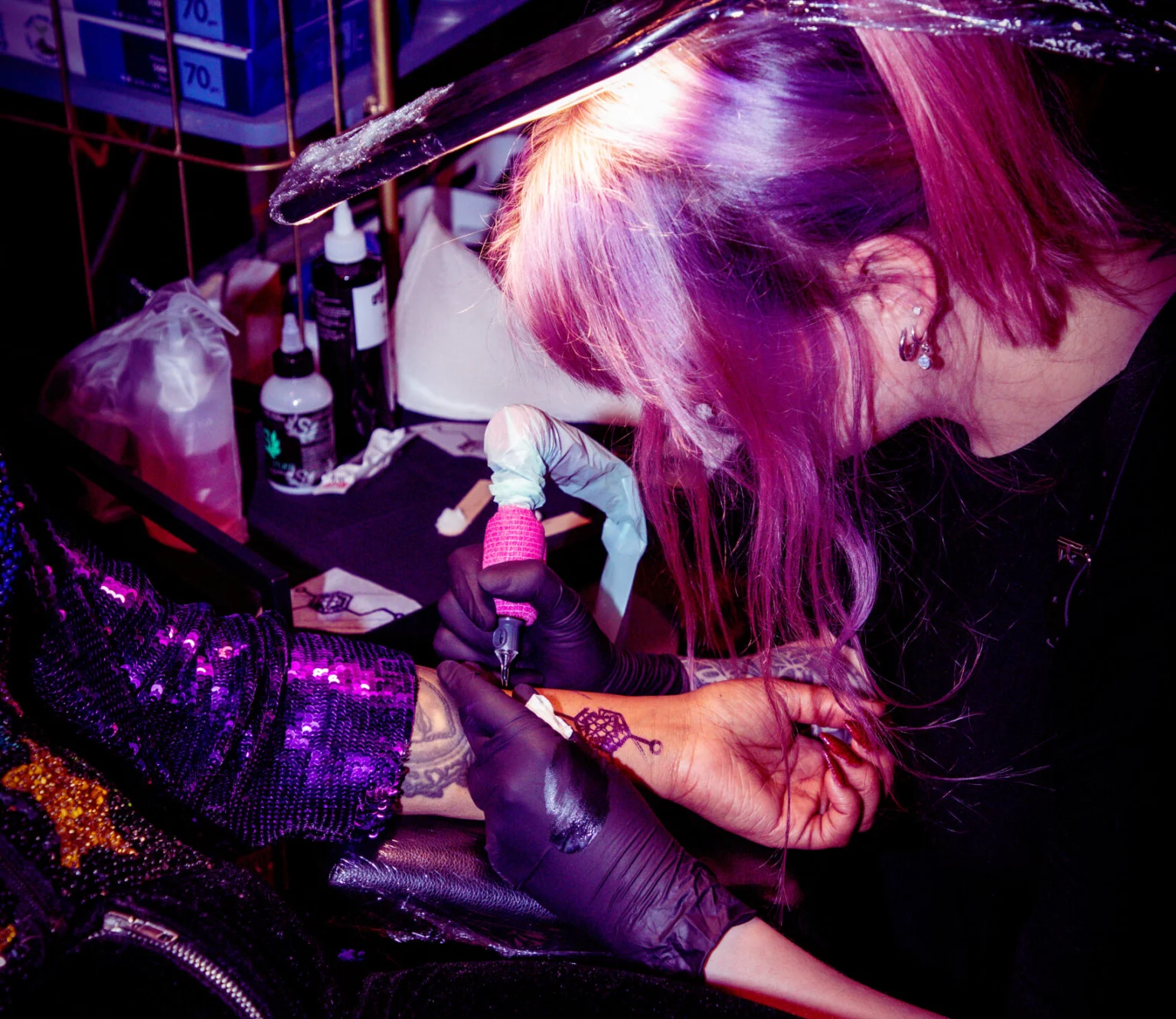 tattooing a client at shallows